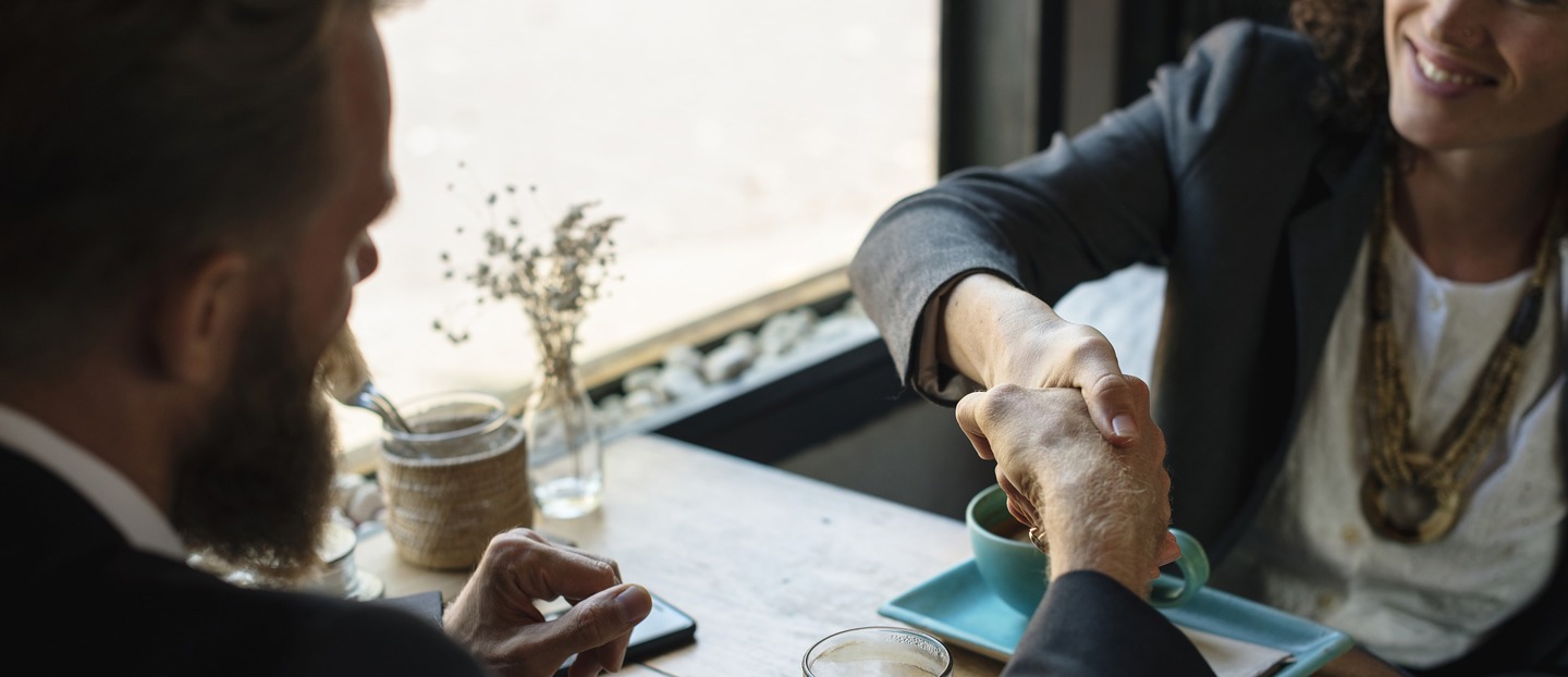 A man and a women shaking hands