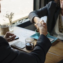 A man and a women shaking hands