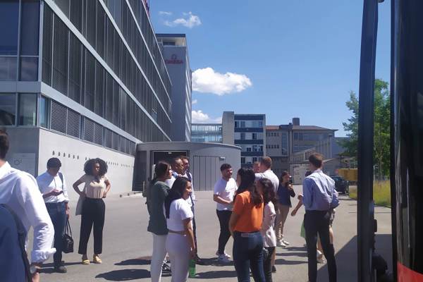 Attente students waiting in front of Omega, Switzerland