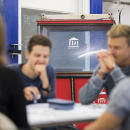 A group of students around a table